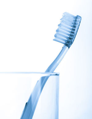 41140056 - tooth brush in glass isolated on white background